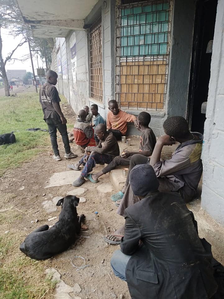 Youth in Kenya waiting for porridge.