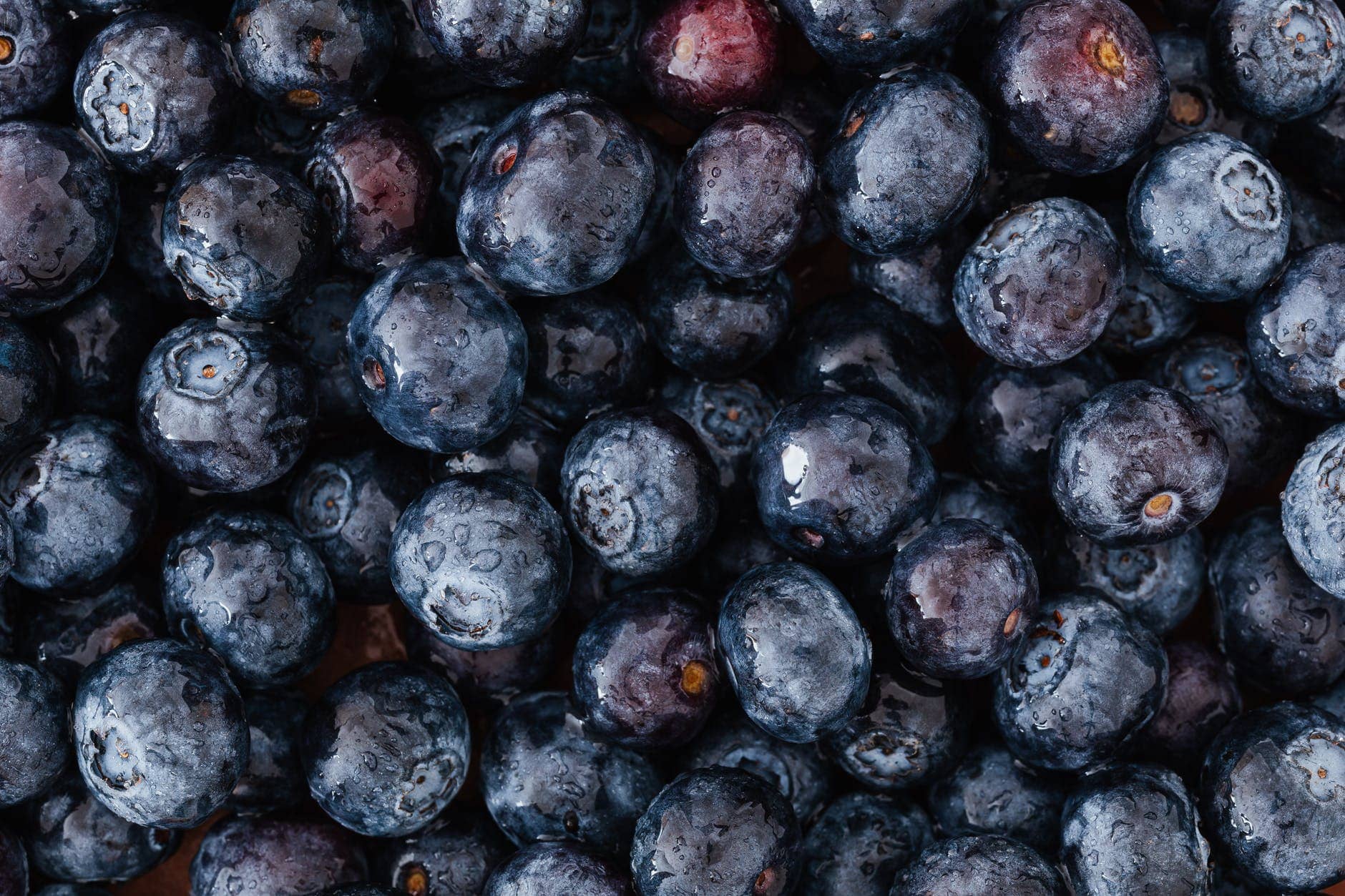 bunch of delicious ripe blueberries lying on market stall